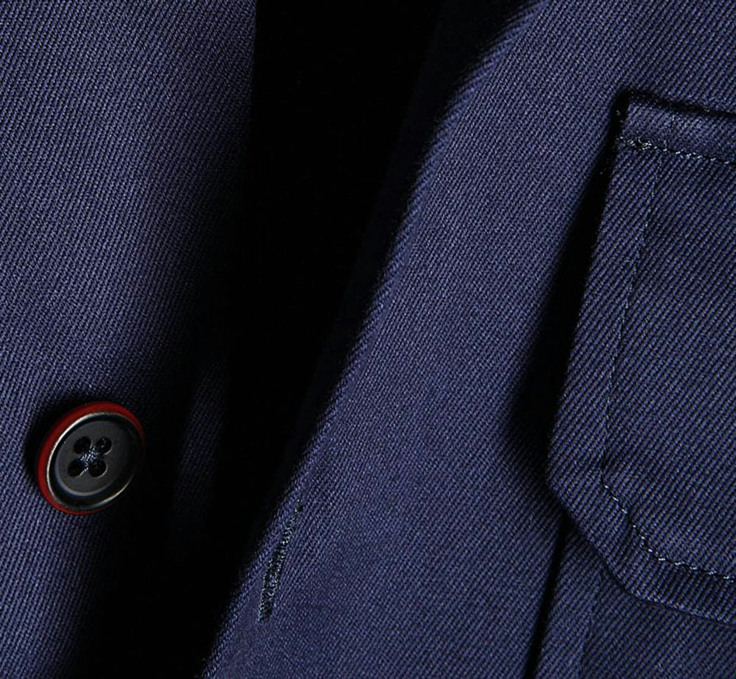 A dark blue suit jacket with a button and pocket.